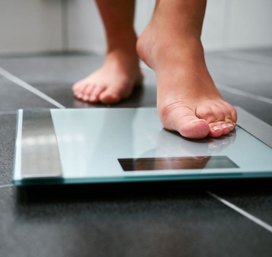 Weight loss - stepping on a scale