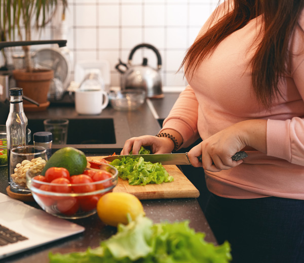 a woman preparing healthy food